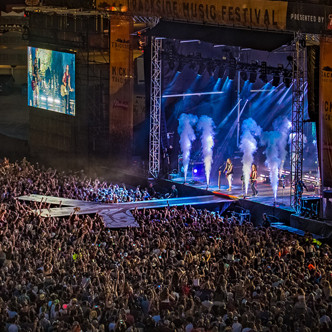 band playing on a stage in front of a audience